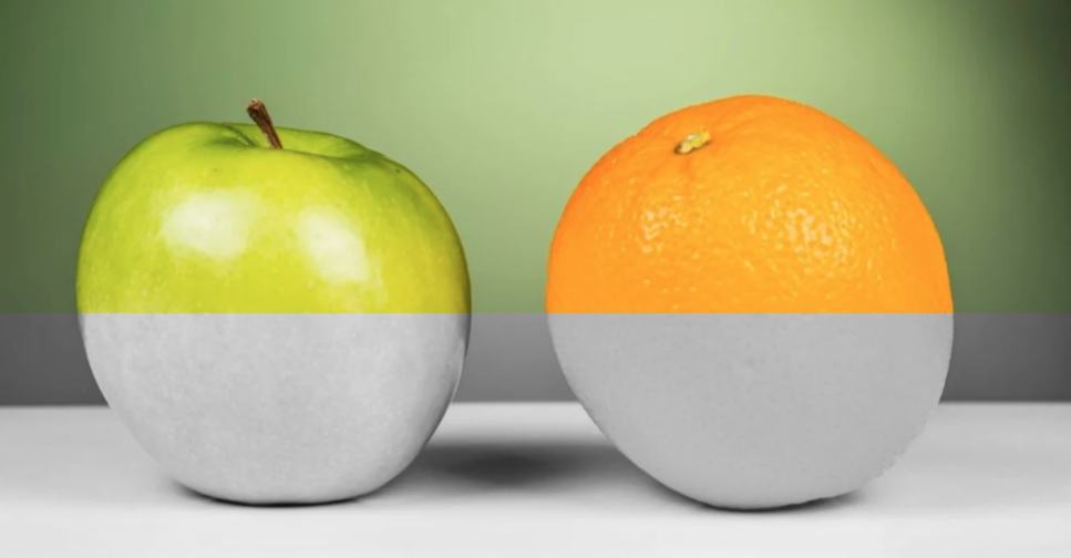 Green apple and an orange split to show in grayscale with poor contrast